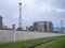 Large fuel tanks. Tanks and ladders of the tank farm. The gloomy atmosphere of an industrial area