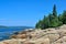 Large Glacial boulders of Pink Granite line the shores of French