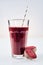 Large glass of nutritious root vegetable drink