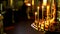 Large gold candle holder with a lot of burning candles in an Orthodox Church