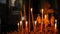 Large gold candlestick with burning candles closeup in the form of a table