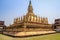 A large golden Buddhist temple with beautiful scenery of the Great Sacred Stupa