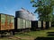 Large Grain Silos behind Peanut Wagons and a Pecan