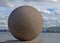 Large granite sphere on Neva embankment. Saint-Petersburg