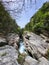 Large granite stones with flowing river water in between