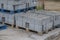 Large gray curbs on wooden pallets