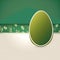 Large green empty easter egg on a cream ivory and green background with easter ornament