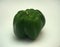 Large green fruit of sweet pepper. Photo on a white background