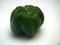 Large green fruit of sweet pepper. Photo on a white background