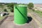 Large green industrial tanks for petrochemical or oil or fuel or