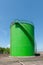 Large green industrial tanks for petrochemical or oil or fuel or
