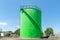 Large green industrial tanks for petrochemical or oil or fuel or