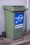 Large green recycling rubbish wheely bin on street