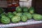 Large green striped watermelons. Fruit background on the counter in the market. Common watermelon Citrullus lanatus