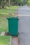 Large green wheelie bin.