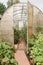 Large greenhouses for growing homemade vegetables. The concept of gardening and life in the country.