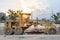 Large ground leveling machine or grader for road or street highway making park at work place with sunset at evening