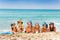 Large group of boys and girls on sea beach