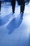 Large group of business people walking, blue toned image