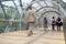 Large group of business people walking through the tunnel in office