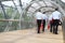 Large group of business people walking through the tunnel in office