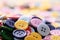 Large Group Of Colorful Plastic Sewing Buttons On Table