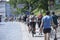 Large group of cyclists moving down the street road. Cycle race among amateurs