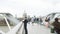 Large group of defocused silhouettes of people walking on the millennium bridge