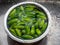 A large group of fresh Tendli or Ivy Gourd aka perennial cucumber Ttndoda washing in Kichan Sink