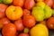 Large group of multicolored, organic tomatoes at farm market