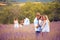 Large group of people in lavender field.