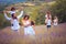 Large group of people in lavender field.