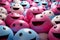 a large group of pink and blue smiley faces