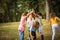 Large group of school kids having fun in nature.  Playfully time