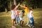 Large group of school kids having fun in nature.  Playing time