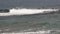 Large group of surfers riding the waves in Okinawa island of Japan