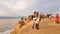 A large group of tourists on Cape Burkhan at the Shamanka rock on the island of Olkhon in Russia in anticipation of sunset