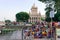 Large group of tourists people sitting on the steps and staircases that lies on the west bank of Hooghly River. Beluá¹› Maá¹­h