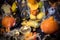 Large halloween decoration table with pumpkins, pine cone, a rat, candles, eyes, a light garland, a vase with fruits and cobwebs