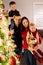 Large Happy Beautiful many children family in evening decorates Christmas tree