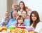 Large happy family having tea