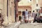 Large happy family walking in old city in Italy.