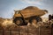 large haul dump truck at a construction site filled with dirt