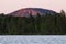 A large hill during midsummer sunrise in Finnish taiga
