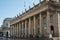 Large historic stone building with grand columns in Bordeaux, Spain
