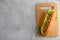 Large Hotdog on wood cutting board