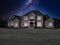 Large  house with a dramatic starry night sky