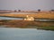 Large houseboat laying on Namibian side of bank of Chobe River in Chobe National Park, Botswana, Southern Africa