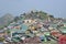 Large housing community over a small hill behind Golden Rock (Kyaiktiyo Pagoda)