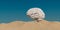 a large human brain sitting on top of a sandy hill in the desert with a blue sky in the background, a surrealist sculpture,